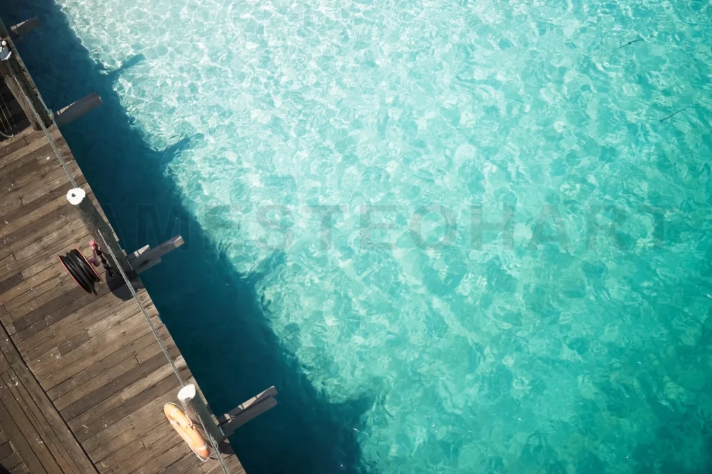 
Wooden Jetty With Crystal Clear And Turquoise Sea Water Of The Tropical Sea