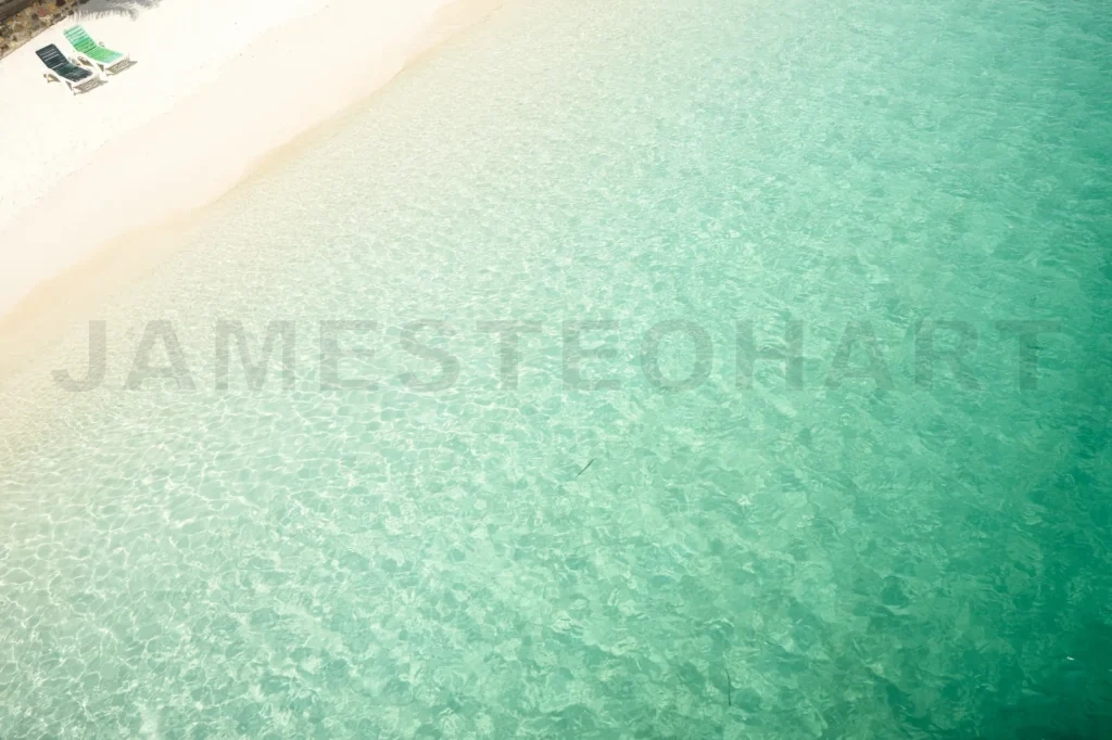 
Beach Tropical With Two Relaxing Chair ,White Sandy And Crystal Water Seen From Above