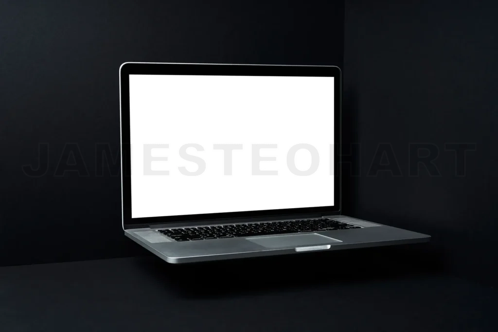 
Floating laptop with blank screen on dark background