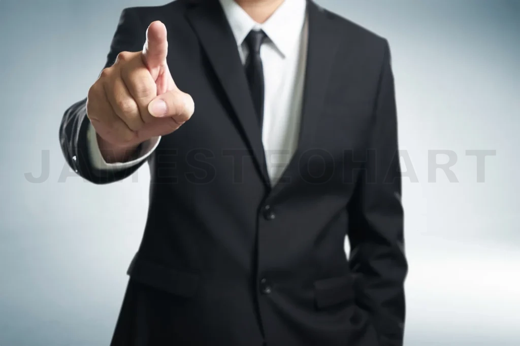 
Business Man Points His Finger At You