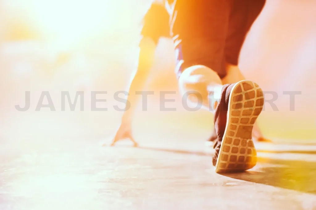 
Athlete In Running Start Pose On The Street With Copy Space , Selected Focus On Shoe With Blurry Background