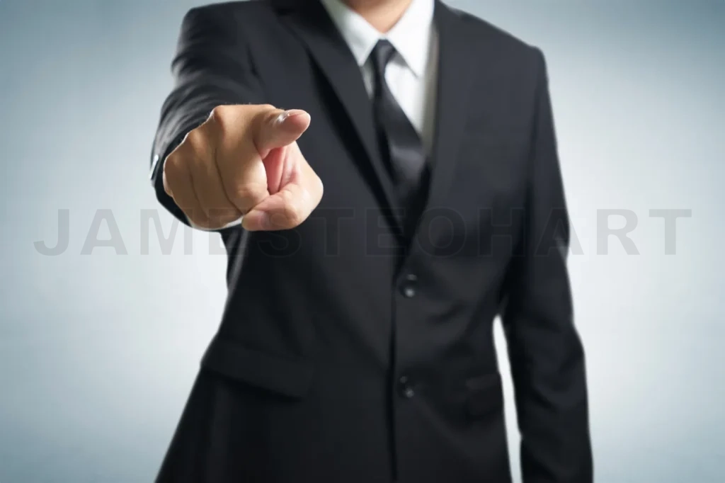 
Business Man Points His Finger At You