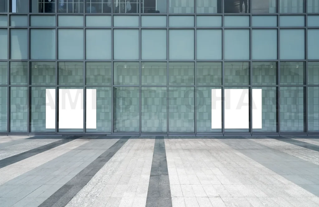 
Modern office building glass facade with blank posters