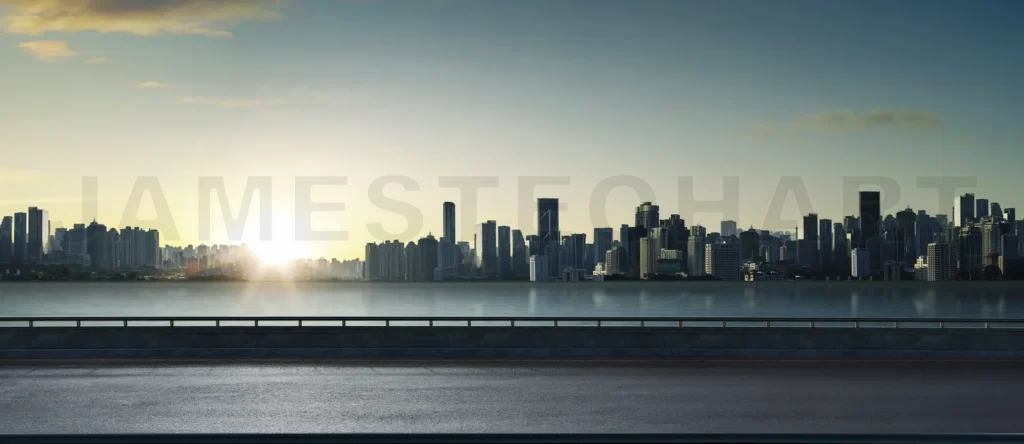 
Panoramic view of empty road side with city skyline