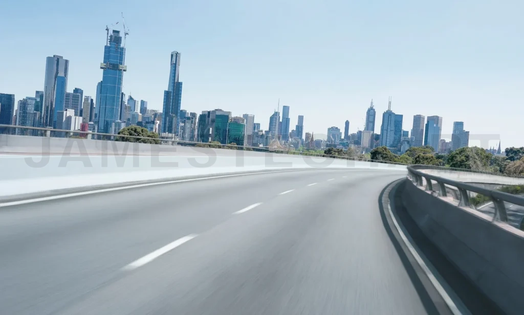 
Melbourne skyline with motion blurred highway curving toward city