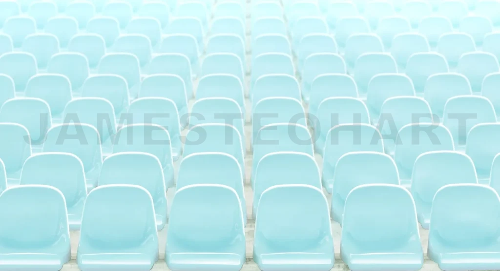 
Rows of empty light blue stadium seats