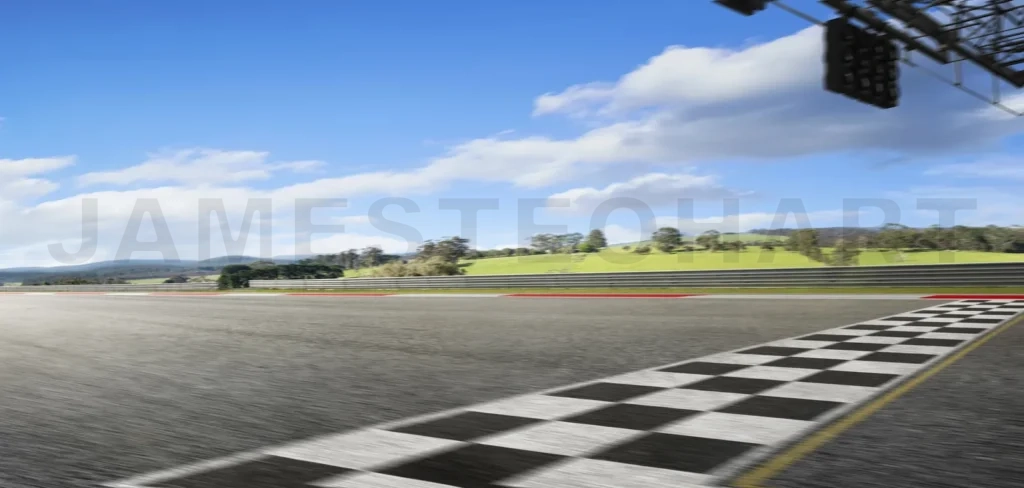 
Racetrack asphalt with checkered finish line under blue sky