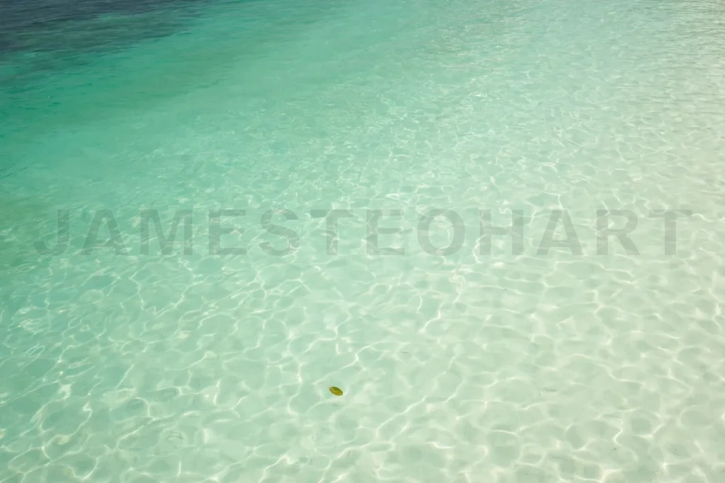 
Shallow clear turquoise ocean water creating ripples