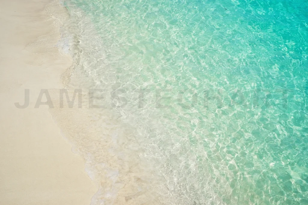 
Clear ocean water washing onto sandy beach