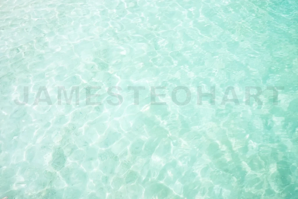 
Clear turquoise water surface creating natural background patterns