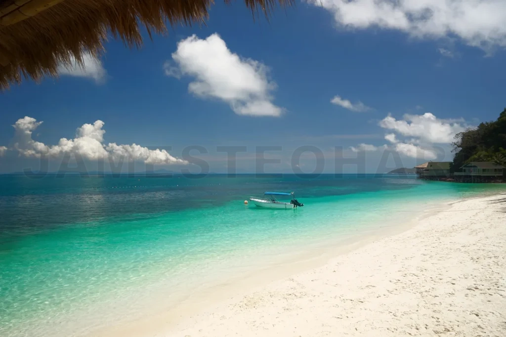 
Tropical beach resort with boat on turquoise water