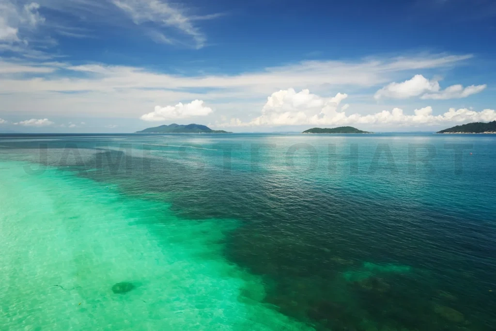 
Tropical ocean water shimmering near distant islands