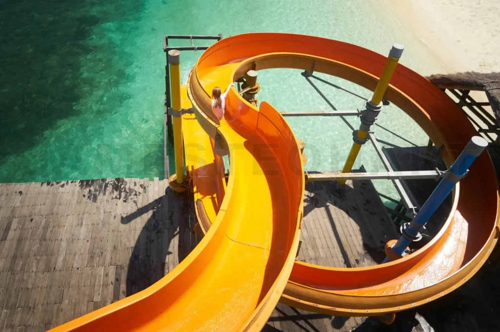 
Child having fun on tropical water slide