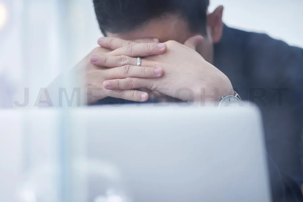 
Stressed businessman suffering headache and workplace burnout
