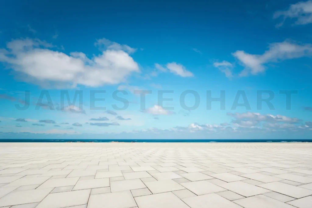 
Empty patio paving extending to ocean horizon