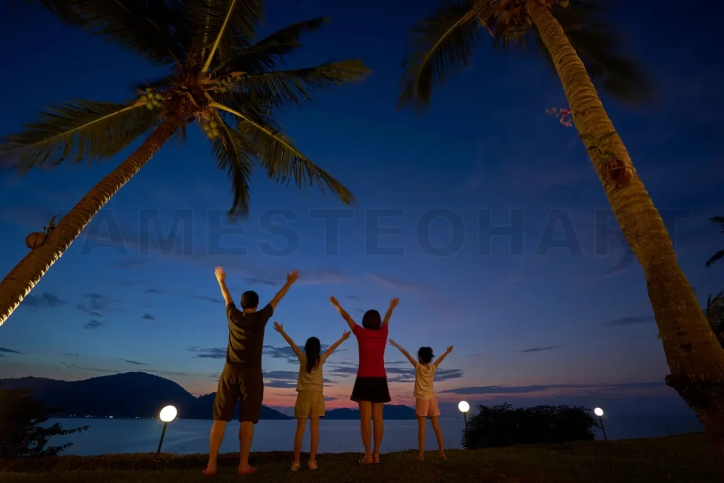 
Family enjoying tropical sunset vacation under palm trees