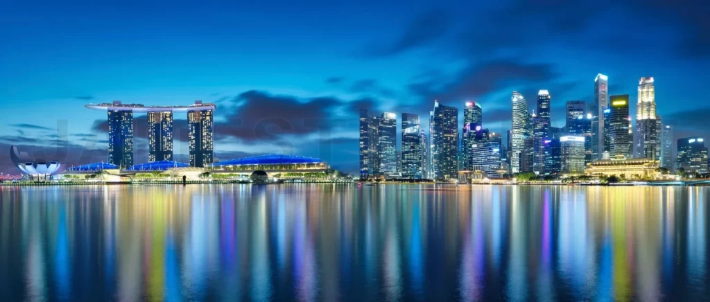 
Singapore city skyline reflecting in water at night