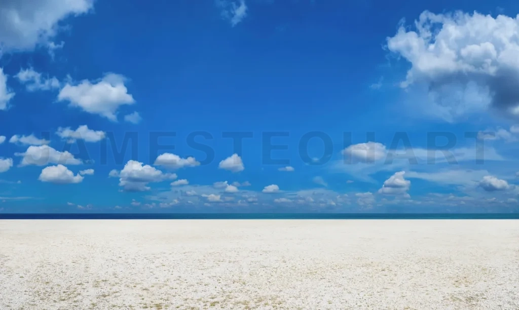 
White sand beach with blue sky and clouds