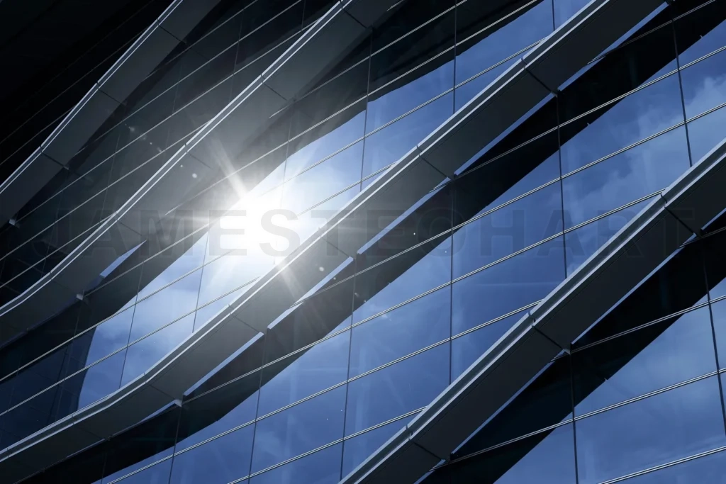
Modern glass building facade with sun flare reflection