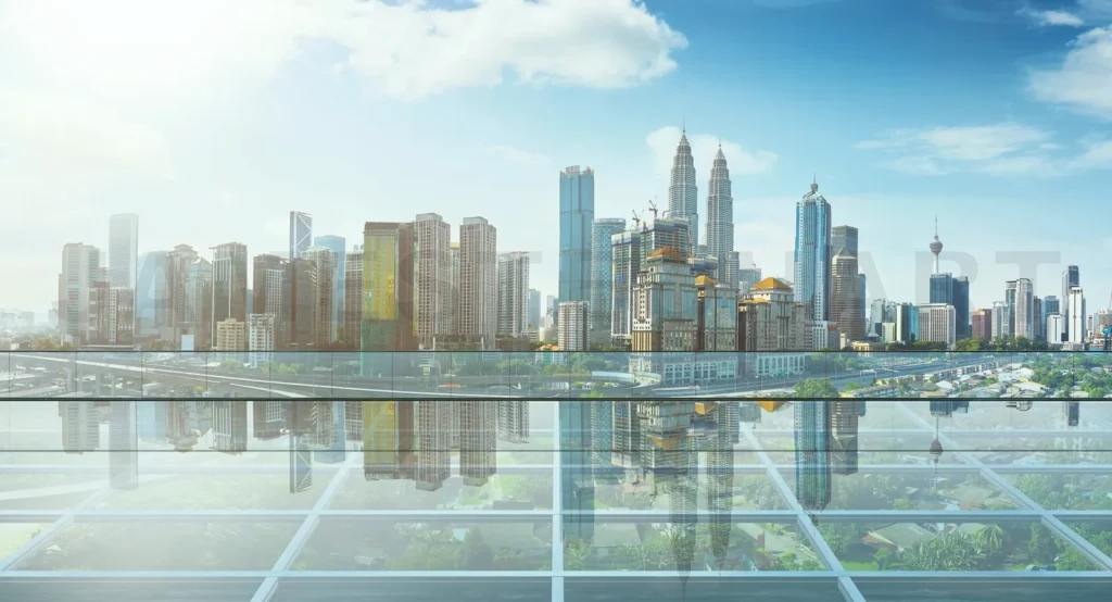 
Kuala lumpur skyline reflecting on modern glass architecture