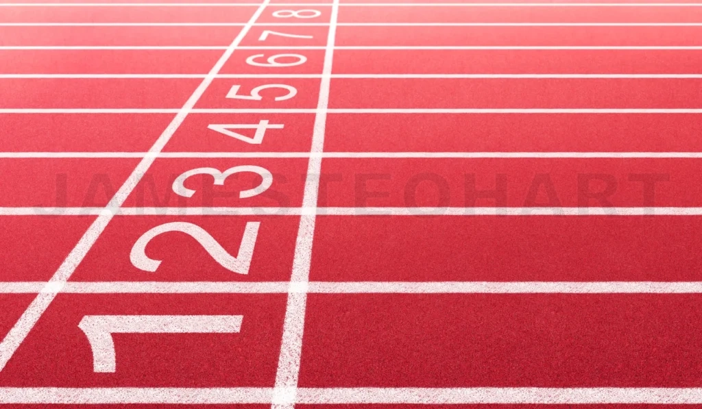 
Red athletic track starting line number lanes