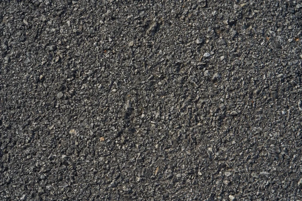 
Closeup black rough asphalt road