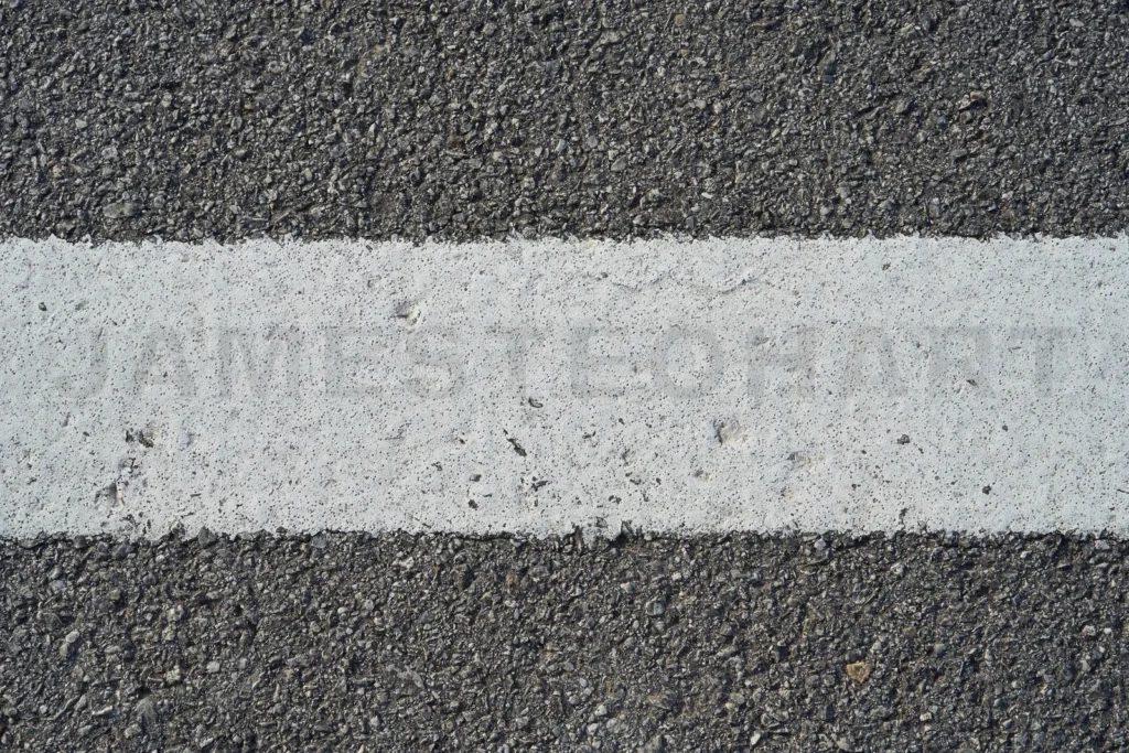 
Closeup black rough asphalt road