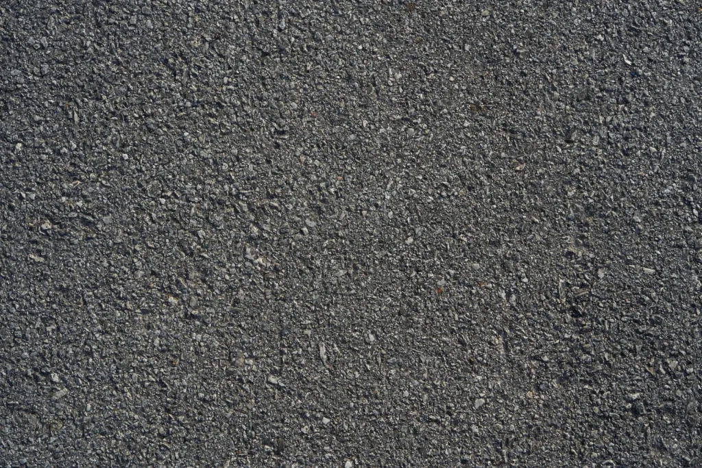 
Closeup black rough asphalt road