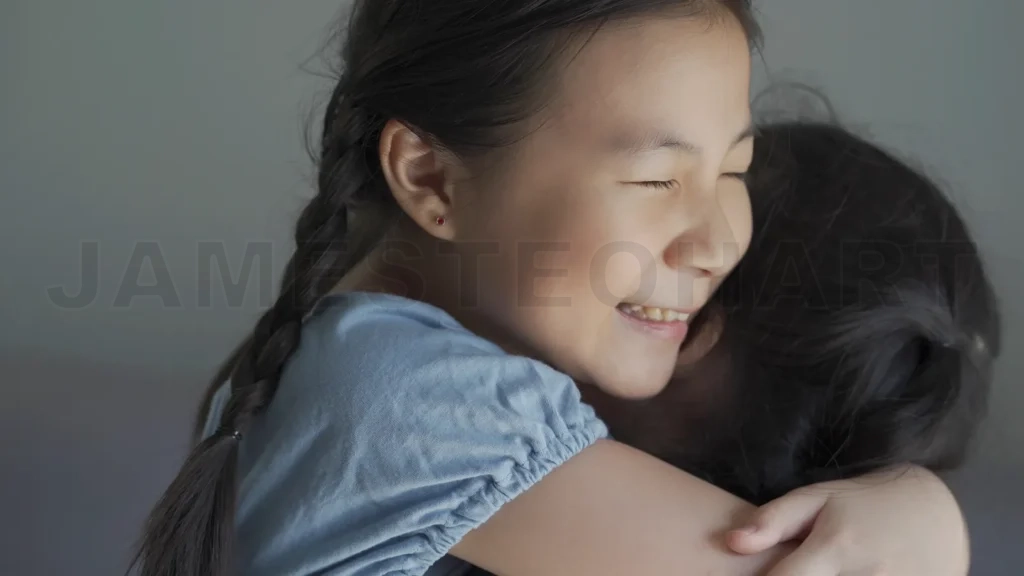 
Beautiful and adopted asian little girl hugging