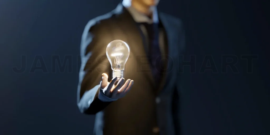 
Business man hold the glowing light bulb