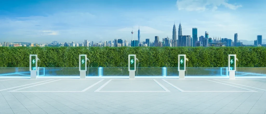 
Electric vehicle charging station with kuala lumpur skyline: promoting sustainable transportation