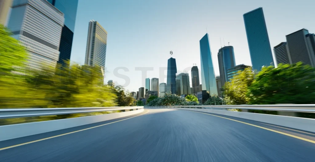 
Highway overpass motion blur with cityscape skyline