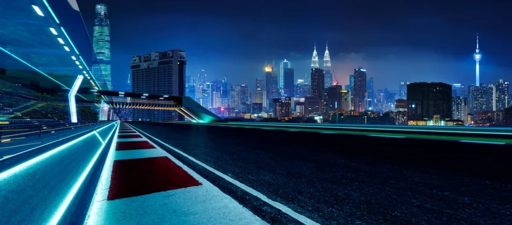 
3d rendering racetrack overlooking kuala lumpur city at night