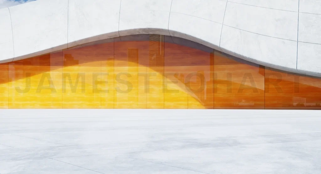 
3D rendering Modern building exterior with large orange glass facade reflecting city skyline