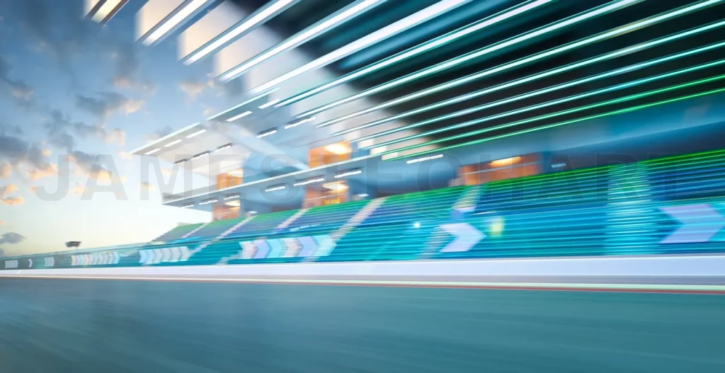 
Race car speeding on a circuit near empty grandstands with motion blur