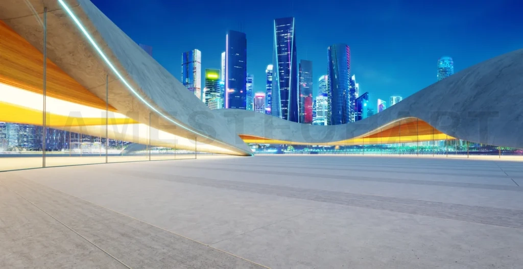
Empty parking lot with illuminated modern architecture and cityscape at night