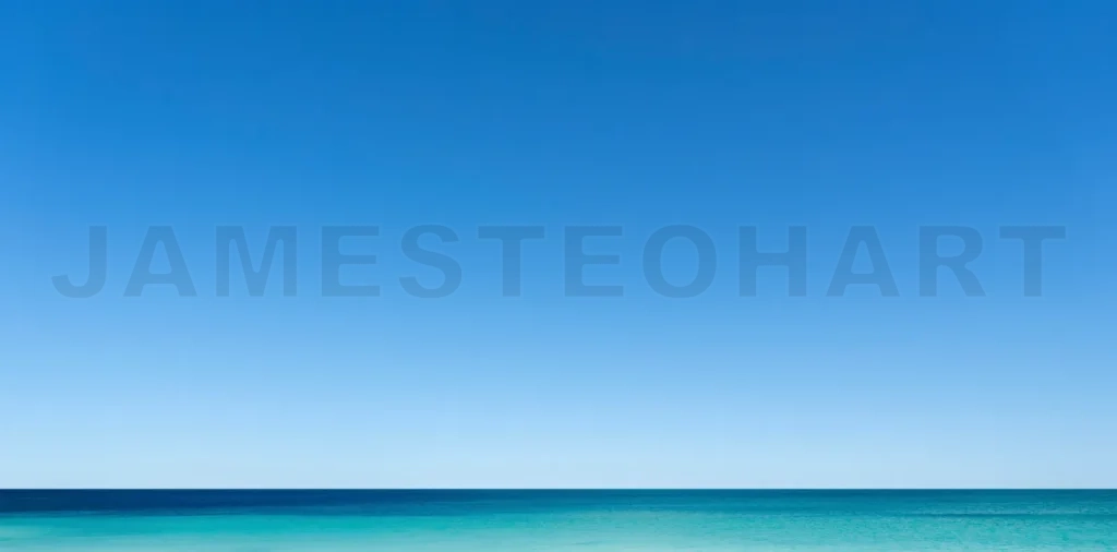 
Calm turquoise water meets deep blue sky on horizon