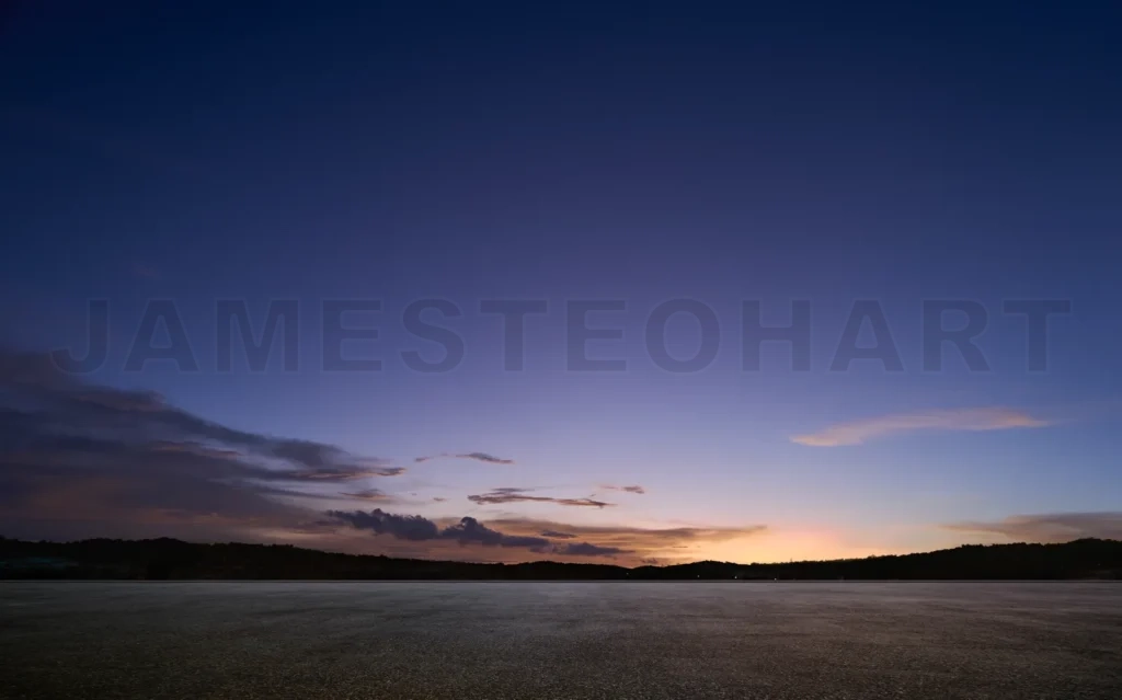 
Empty asphalt floor with sunset sky