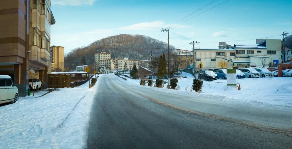 
Empty road with beautiful winter small town
