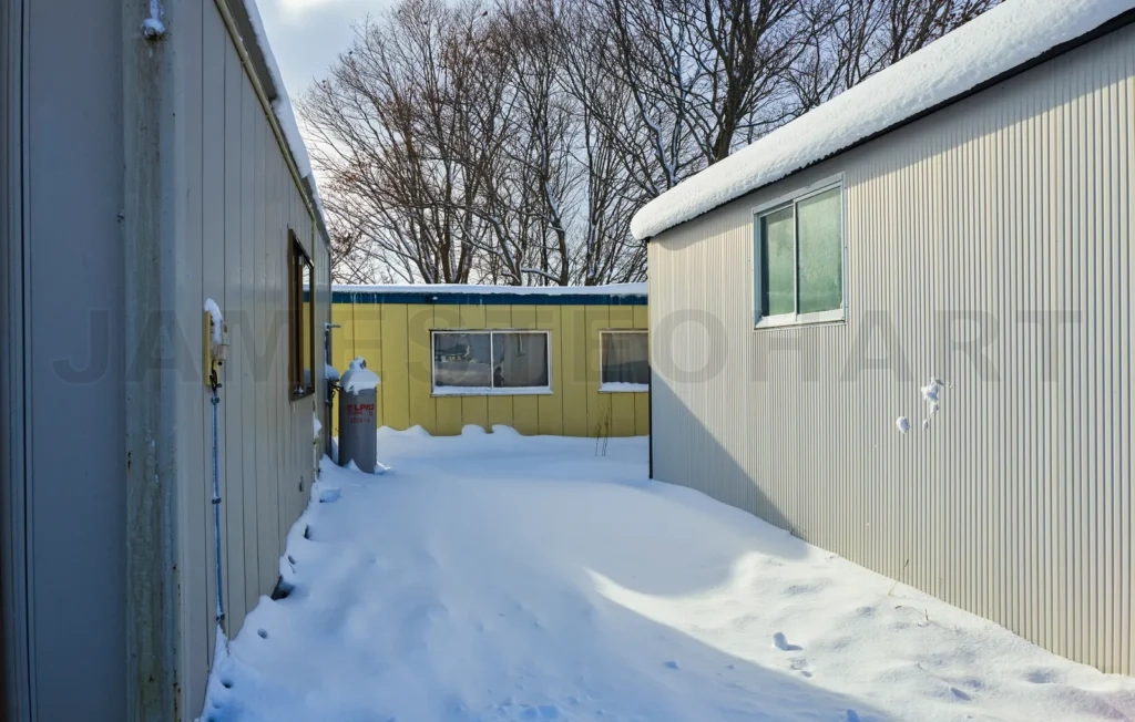 
A small alley in the snow-covered suburbs