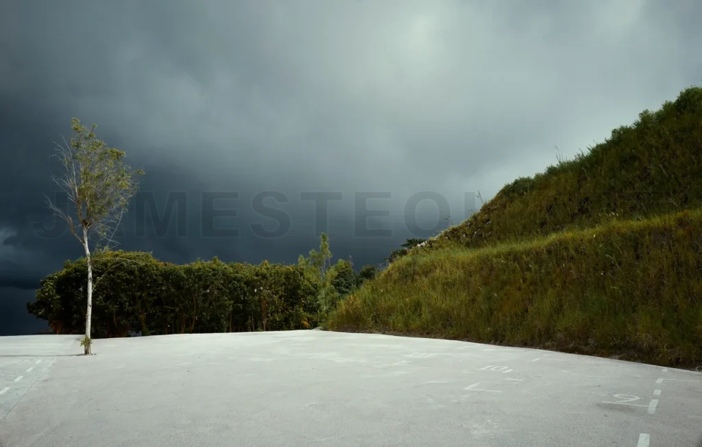 
Empty concrete floor and misty hills