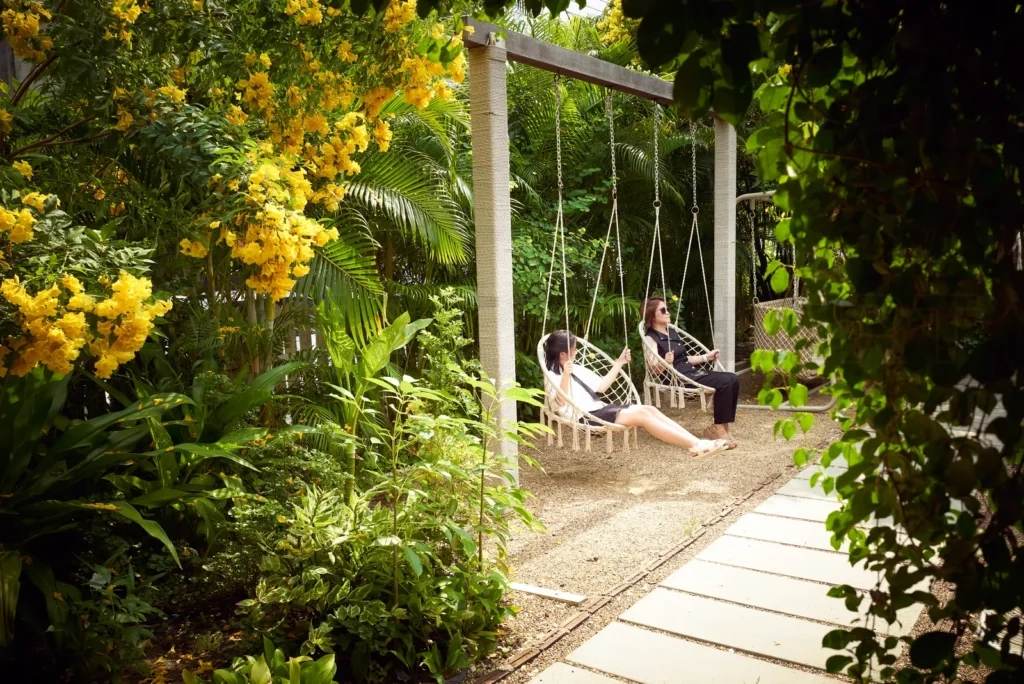 
Mother and daughter enjoying the swing chair in the beautiful re