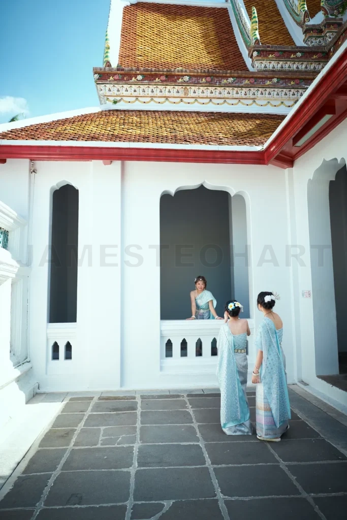 
Asian family dressed in traditional Thai costumes shoot a video