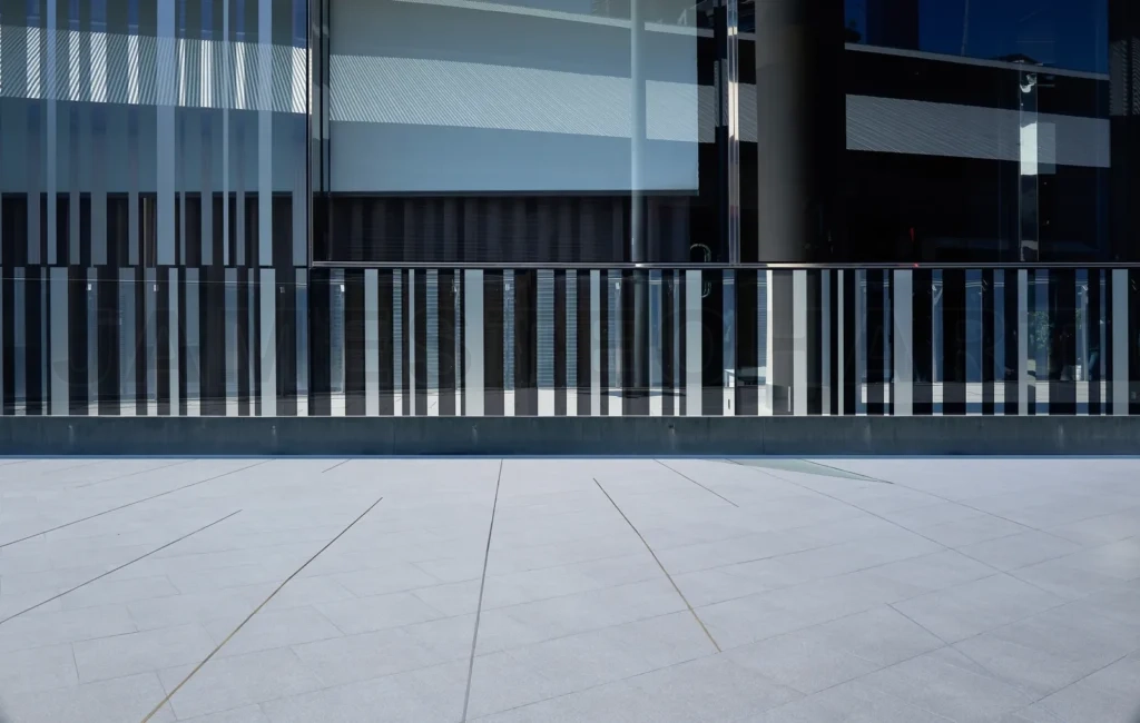 
Empty floor with modern pattern glass wall