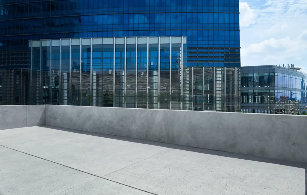 
Empty cement balcony with blue glass facade office building