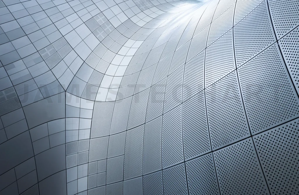 
Modern building exterior showing metallic silver cladding with p