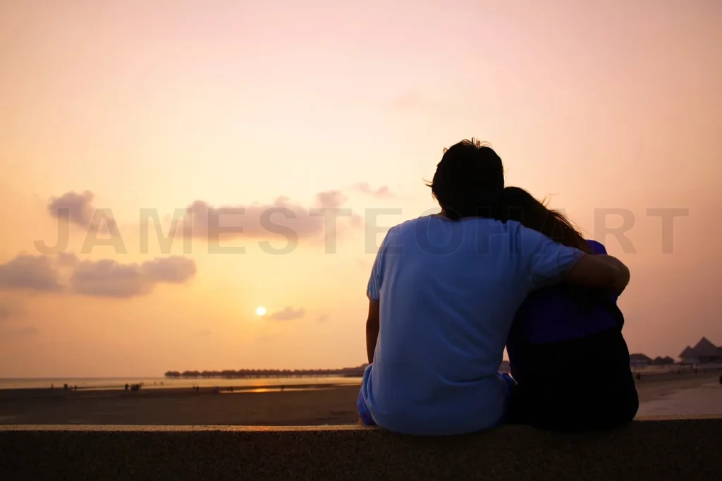 
Couple on the beach at sunrise