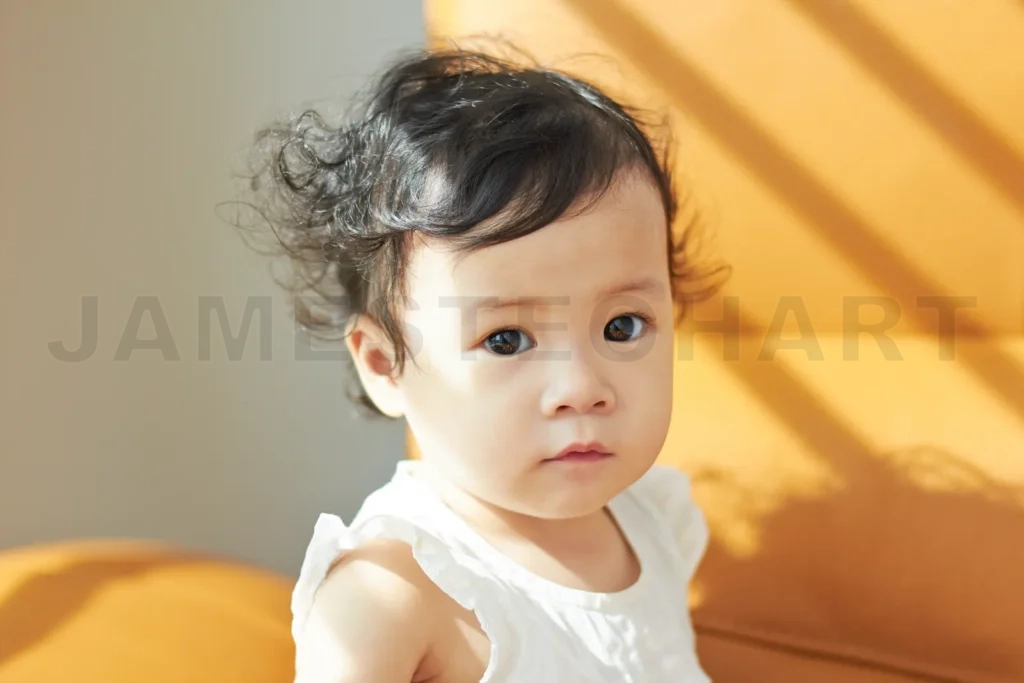 
Portrait Of Cute And Lovely Curly Hair Asian Chinese Baby Girl