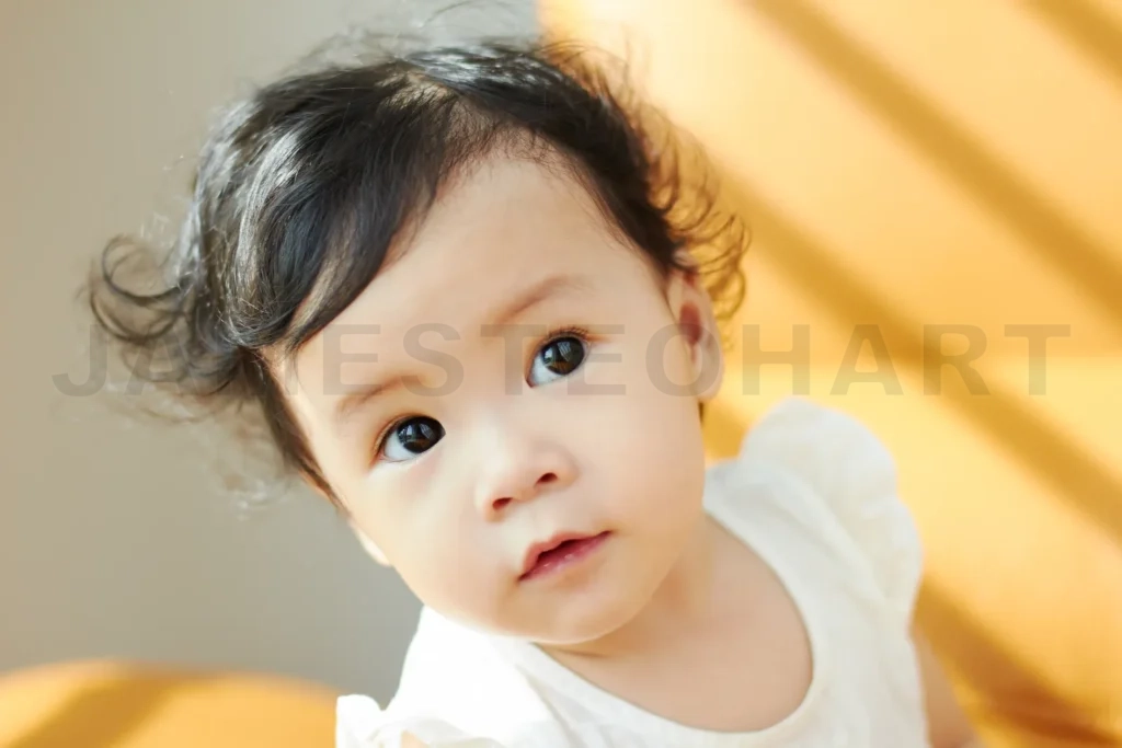 
Portrait Of Cute And Lovely Curly Hair Asian Chinese Baby Girl