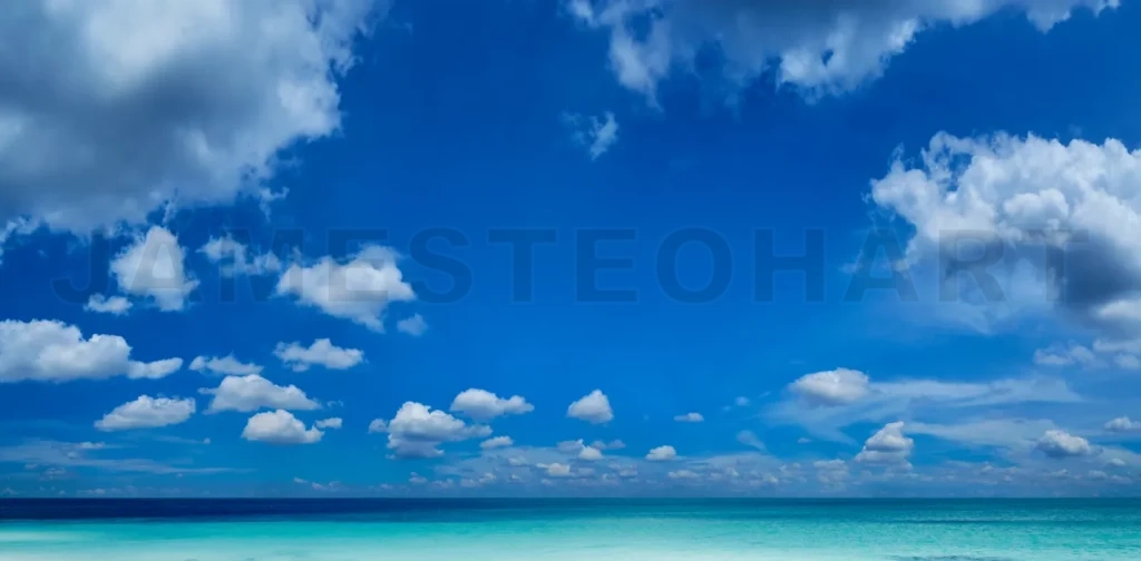 
Beautiful Sea And A Blue Sky With White Clouds